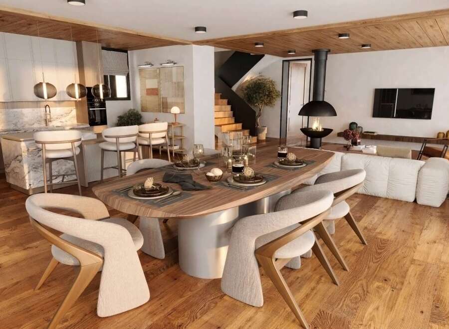 Stunning open-plan living space featuring a modern kitchen with marble island, a cozy living area with a fireplace, and a spacious dining area.