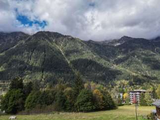 Nestled in the heart of the Alps, this charming wooden chalet offers breathtaking mountain views.