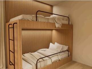 Cozy bunk bed in a modern room with wooden walls and neutral tones.