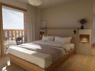 Wake up to breathtaking mountain views from this cozy bedroom.