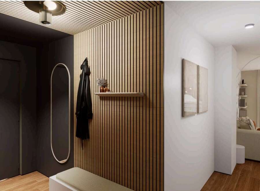 Stylish apartment hallway with wood slat wall, built-in bench, and modern lighting.