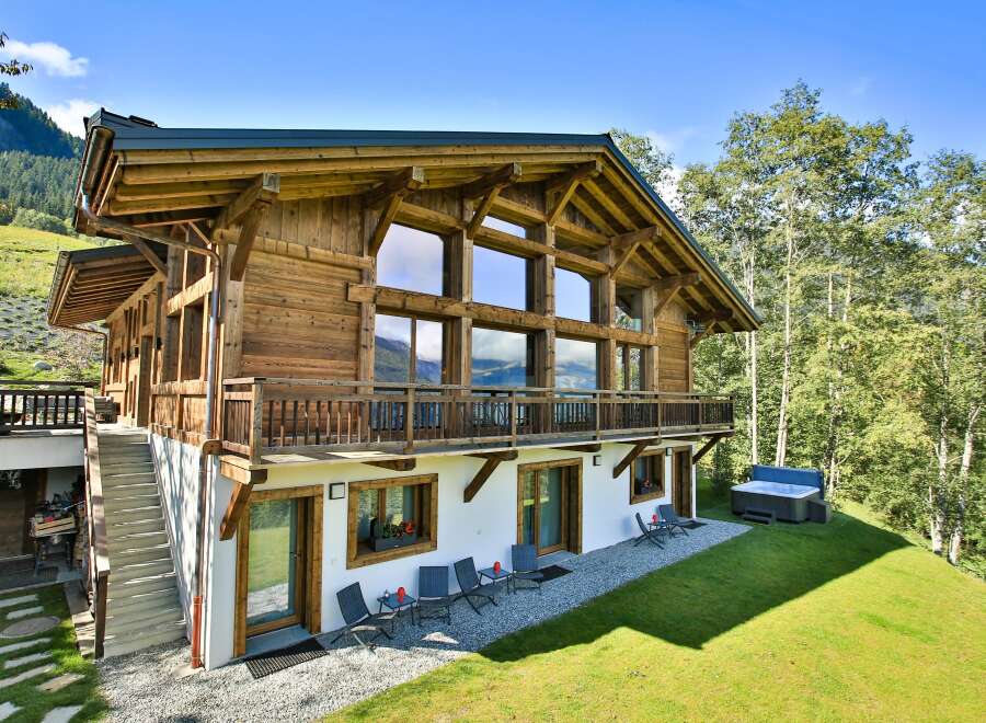 This stunning wooden chalet offers a luxurious retreat with breathtaking mountain views.