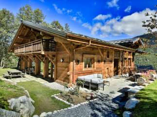 Experience the epitome of alpine luxury in this stunning wooden chalet.