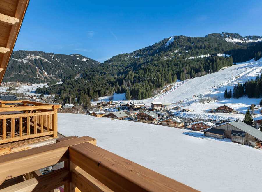 This stunning chalet boasts breathtaking views of the snow-capped mountains and ski slopes.