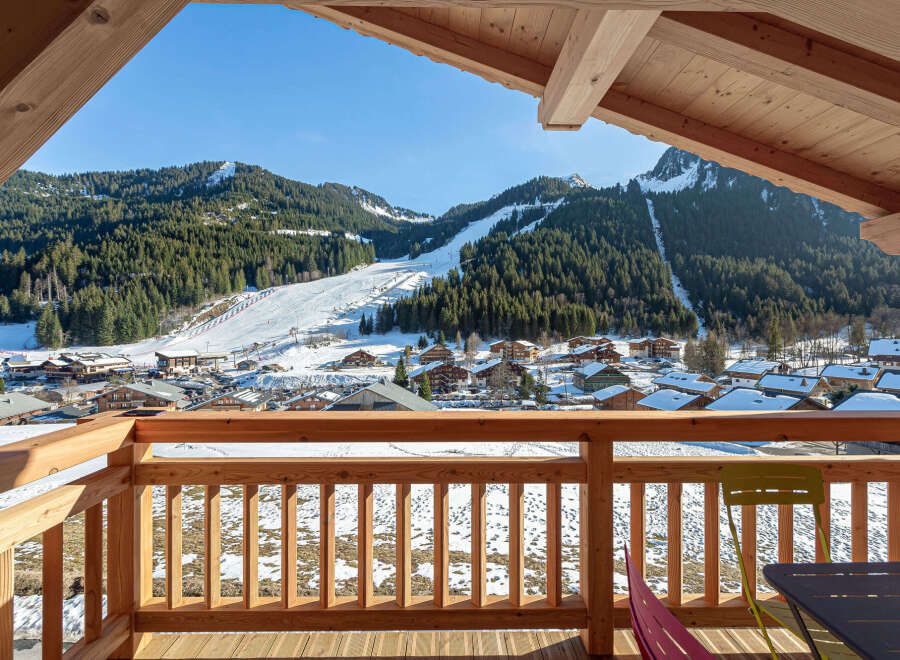 This stunning chalet boasts breathtaking views of the snowy mountains and ski slopes.