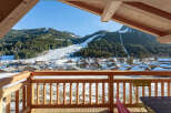 This stunning chalet boasts breathtaking views of the snowy mountains and ski slopes.