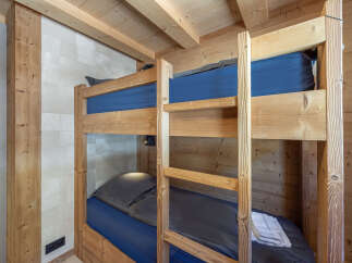 Cozy chalet with rustic bunk beds, perfect for a family getaway.