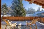 Enjoy breathtaking mountain views from this cozy balcony.