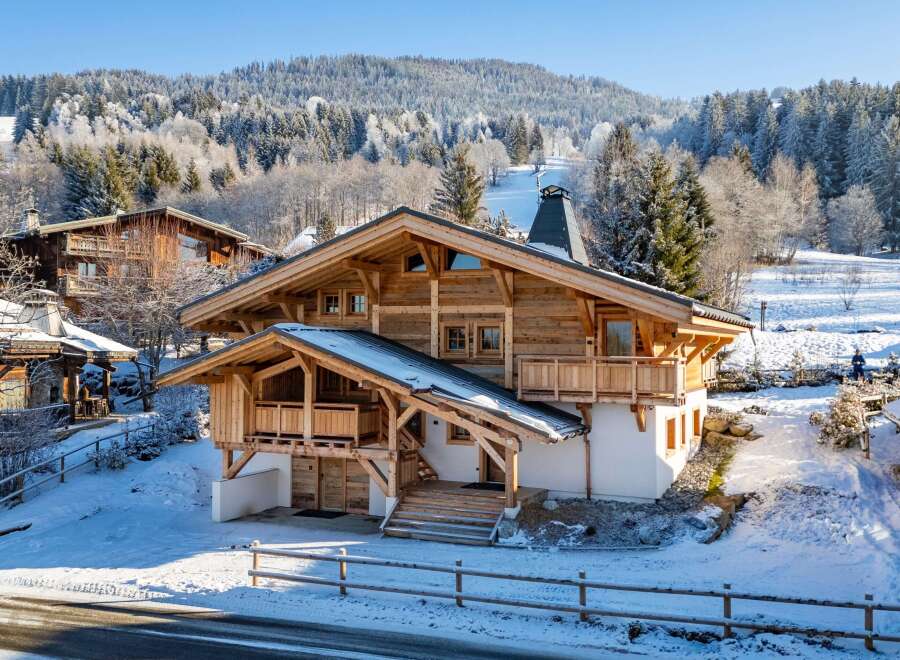 Experience the ultimate winter getaway in this stunning chalet nestled in a snowy landscape.