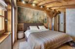 Experience rustic elegance in this stunning bedroom.