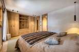 Experience the epitome of rustic elegance in this stunning bedroom.
