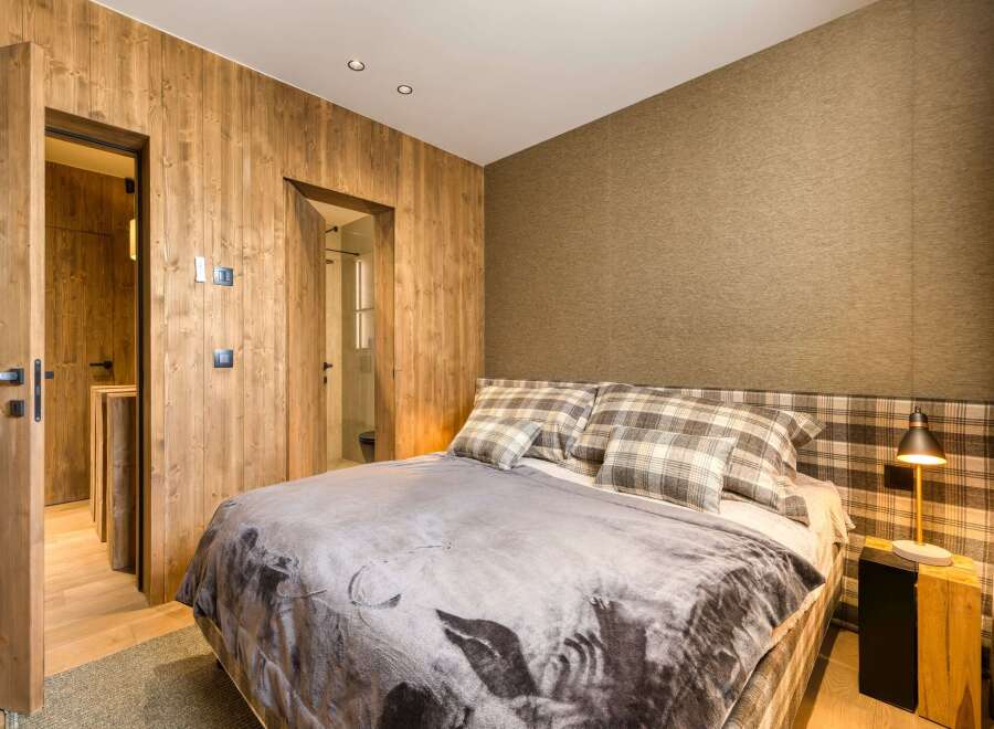 Experience rustic elegance in this cozy bedroom.