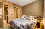 Experience rustic elegance in this cozy bedroom.