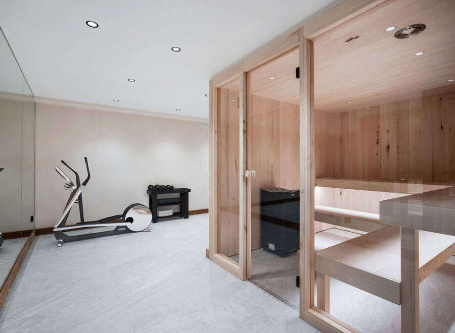 This stunning home boasts a luxurious, in-home gym and sauna, perfect for relaxation and fitness.