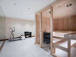 This stunning home boasts a luxurious, in-home gym and sauna, perfect for relaxation and fitness.
