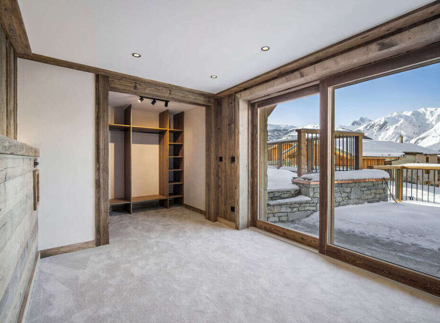 This stunning chalet boasts a spacious walk-in closet, perfect for storing all your winter gear.