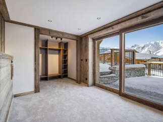 This stunning chalet boasts a spacious walk-in closet, perfect for storing all your winter gear.