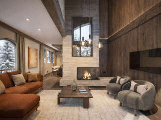 Experience luxury living in this stunning property featuring a cozy living room with a fireplace and comfortable seating.