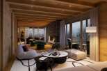 Luxury chalet with stunning mountain views and a spacious open-plan living area.