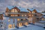 Luxury chalet apartments in a stunning snowy mountain setting.