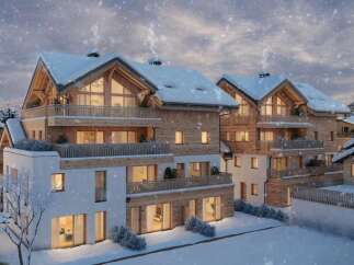 Luxury chalet apartments in a stunning snowy mountain setting.