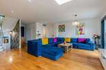 Stunning living room with hardwood floors and a large sectional sofa.