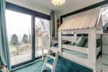 This stunning property boasts breathtaking views from its large windows and private balcony.