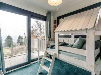 This stunning property boasts breathtaking views from its large windows and private balcony.