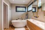 Luxurious bathroom with freestanding bathtub and double vanity.