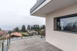 Luxury lake view property with modern design and spacious balcony.
