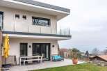 Modern house with a spacious patio, perfect for outdoor entertaining.