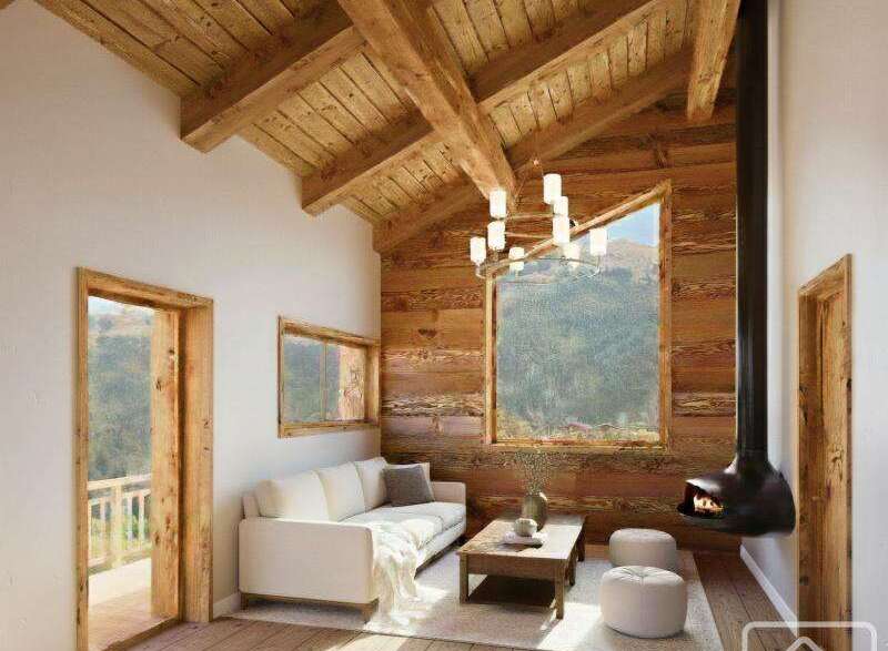 Experience the charm of this stunning property, featuring a cozy living room with a unique fireplace and a beautiful wooden ceiling.