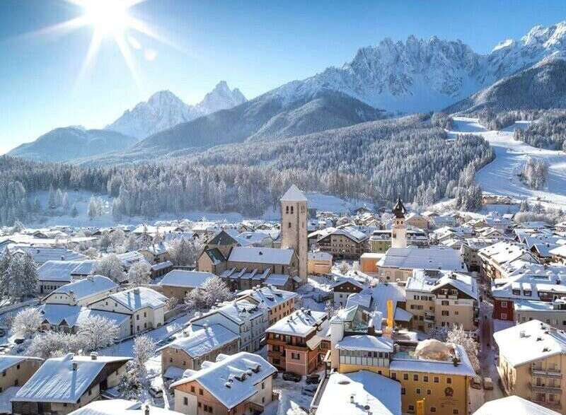 Experience the charm of a snow-covered village nestled in the heart of the mountains.