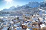 Experience the charm of a snow-covered village nestled in the heart of the mountains.