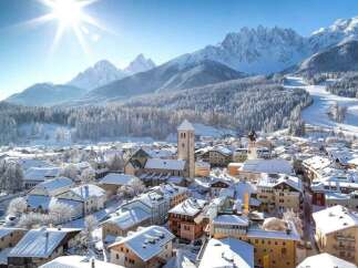 Experience the charm of a snow-covered village nestled in the heart of the mountains.