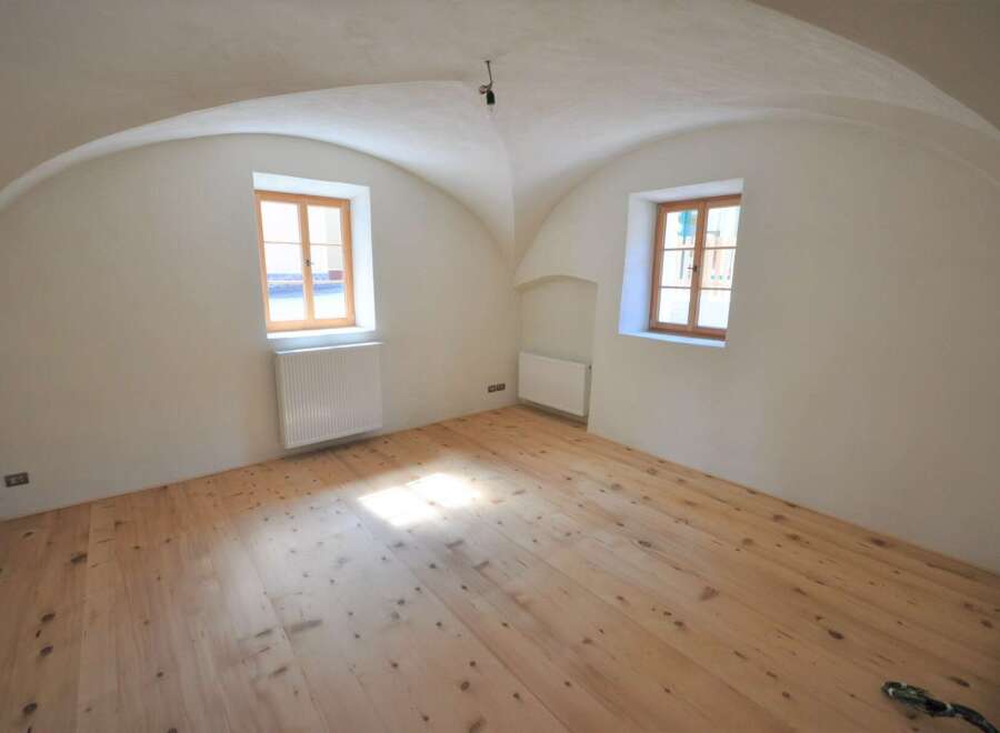 Discover the charm of this unique property featuring a beautifully arched ceiling and natural light pouring in through the windows.