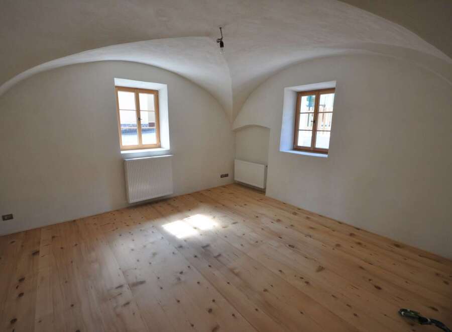 Discover the charm of this unique property featuring a beautifully arched ceiling and natural light pouring in through the windows.