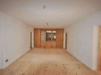 Discover the charm of this inviting space, featuring warm wooden floors and a bright, airy atmosphere.