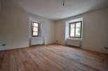 Discover the charm of this inviting room, featuring beautiful wooden floors that add warmth and character.