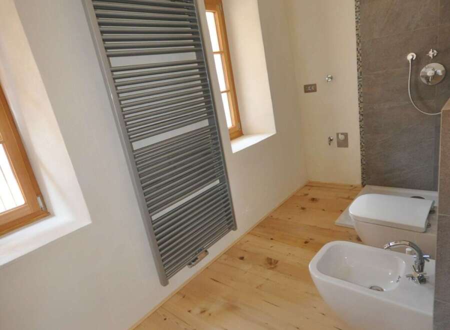 This beautiful bathroom features a modern design with a touch of rustic charm.
