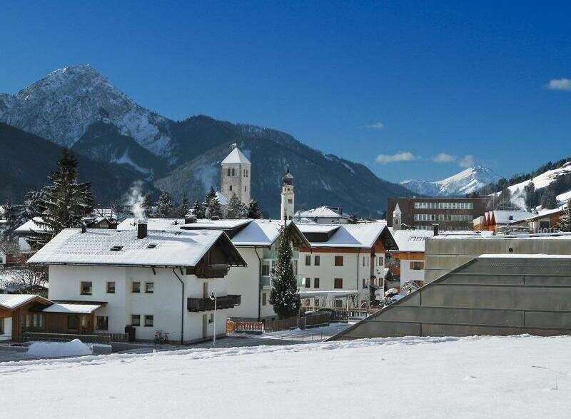 Experience the charm of this picturesque village nestled amidst snow-capped mountains.