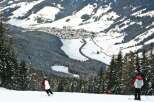 Enjoy breathtaking views of the snow-covered mountains and a charming village nestled in the valley.