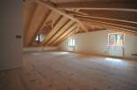 Discover the charm of this stunning attic space, featuring a beautifully crafted wooden ceiling and floors.