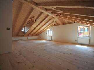Discover the charm of this stunning attic space, featuring a beautifully crafted wooden ceiling and floors.