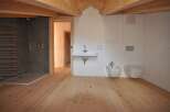 This stunning bathroom boasts a modern design with a touch of rustic charm.