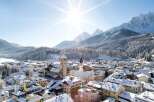 Experience the charm of a snow-covered village nestled in the heart of the mountains.
