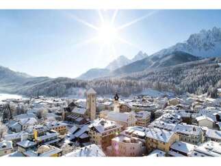 Experience the charm of a snow-covered village nestled in the heart of the mountains.