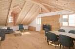 Experience the charm of this stunning attic apartment, featuring a warm and inviting wooden interior.