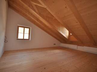 Discover the charm of this stunning property, featuring a beautifully crafted wooden ceiling and floors that exude warmth and character.
