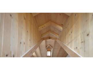 Explore the stunning architectural details of this wooden structure.